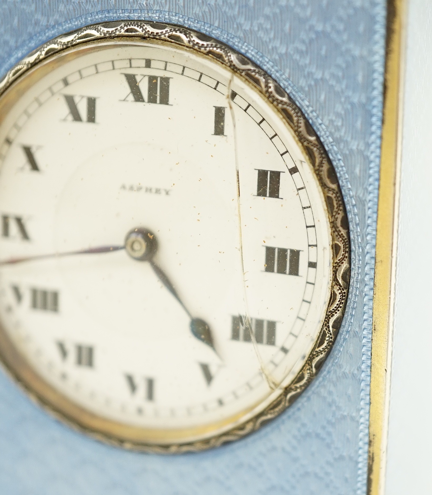 A George V continental silver and blue guilloche enamel miniature timepiece, retailed by Asprey